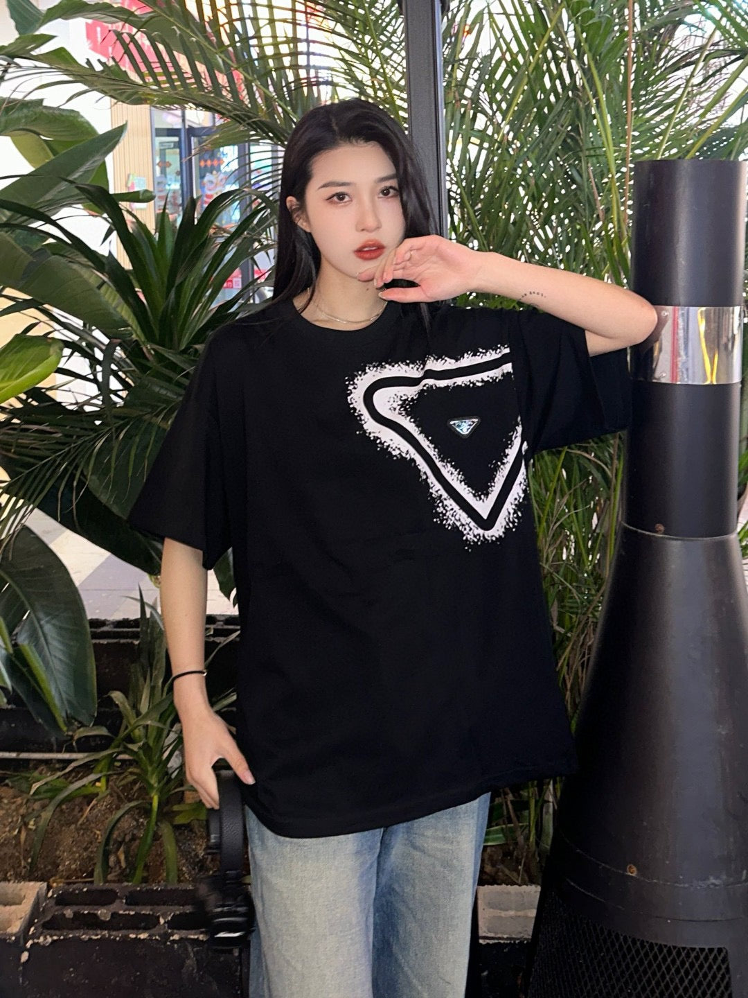 Prada Black Triangle Logo T-Shirt with Eye-Catching Spray Paint Design